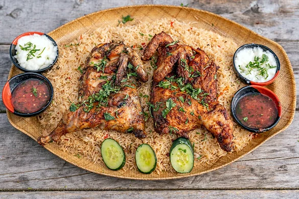 Mandi with roasted chicken on rice