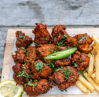 Chicken 65 with fries and lemon