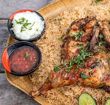Mandi with chutneys and garlic sauce